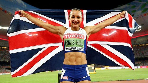 Jessica Ennis-Hill holds the Union Jack aloft after winning world gold in 2015