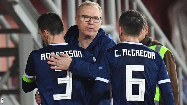 Scotland head coach Alex McLeish celebrates with Andrew Robertson and Callum McGregor