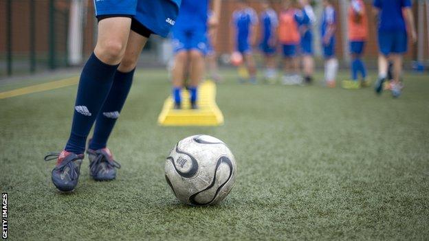 Youth footballers practising