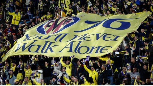 Villarreal fans carry banner