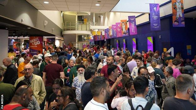 Supporters waited outside the viewing area while the arena was checked by members of staff