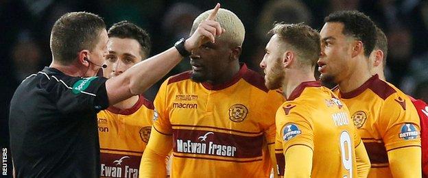 Referee Craig Thomson sends off Motherwell defender Cedric Kipre