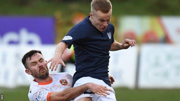 Partick Thistle's Scott Tiffoney and Dundee United's Scott McMann