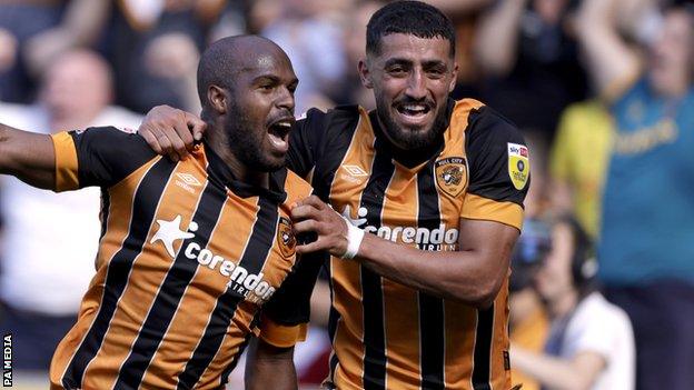 Oscar Estupinan (left) celebrates scoring for Hull against Norwich