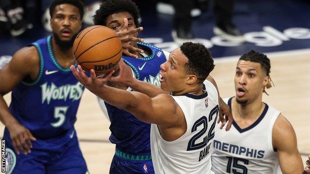 Desmond Bane makes a shot