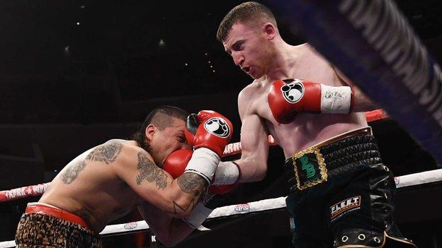 Adrian Dimas Garzon feels the force of a Paddy Barnes punch in the flyweight contest