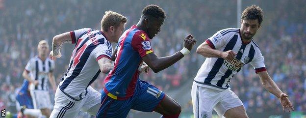 Wilfried Zaha takes on the West Brom defence