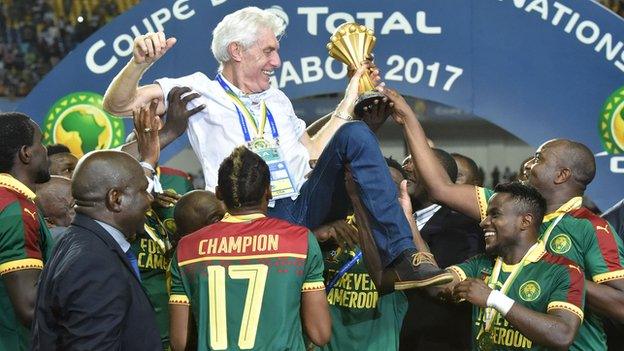 Cameroon boss Hugo Broos is lifted aloft by his players