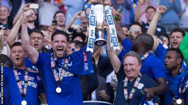 Sean Morrison (L) celebrates promotion to the Premier League with Cardiff City manager Neil Warnock