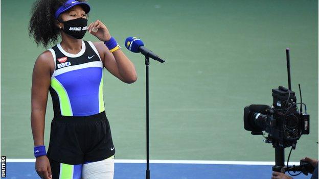 Naomi Osaka wearing a face mask bearing the name of Ahmaud Arbery, a black man who was shot dead while jogging in Georgia in February.