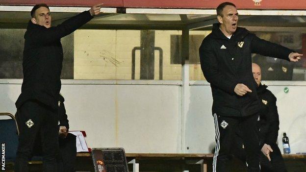 Manager Kenny Shiels (right) and son Dean, who is the squad's coach, shout out instructions to the Northern Ireland players in Tuesday's game