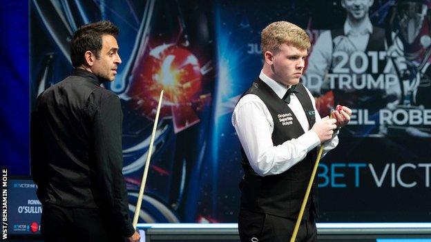 Ronnie O'Sullivan and Aaron Hill during their match at the European Masters
