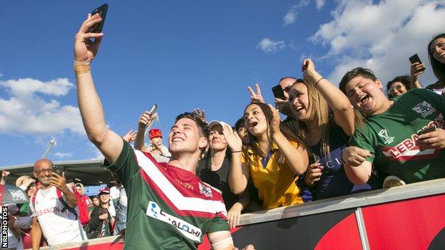 Lebanon celebrate their victory over France in their opening match