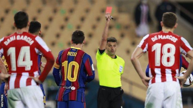 Lionel Messi is shown a red card in the Spanish Super Cup final