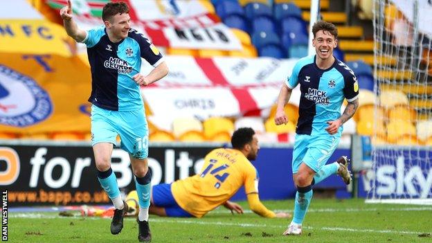 Paul Mullin celebrates his first goal for Cambridge United against Mansfield Town