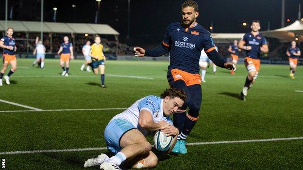 Josh McKay scores a try for Glasgow against Edinburgh