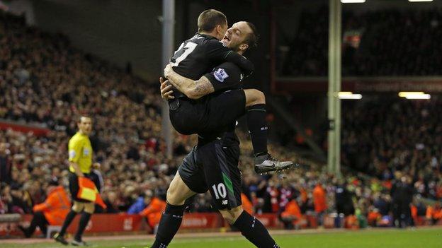 Bojan Krkic (left) helps to celebrate Marko Arnautovic's goal at Anfield in the Capital One Cup semi-final second leg