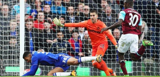 Ruben Loftus-Cheek tumbles to the ground as Michail Antonio watches on