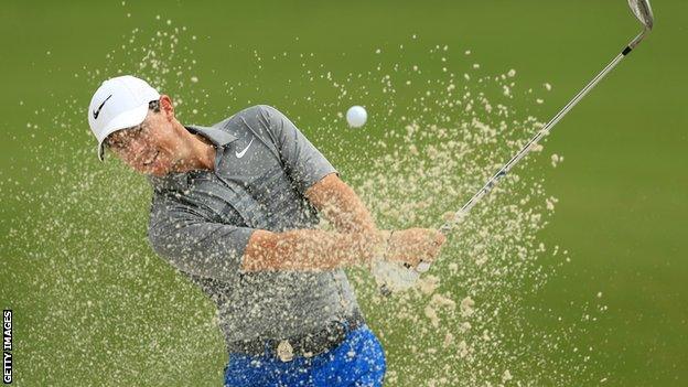 Rory McIlroy splashes out of a bunker during practice for the US PGA Championship