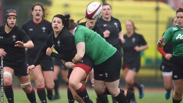 Rebecca De Filippo of Wales is tackled by the Ireland defence