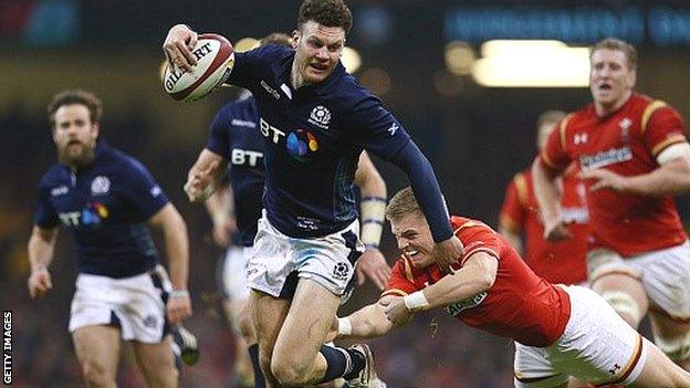 Duncan Taylor evades Gareth Anscombe's tackle before scoring Scotland's second try against Wales