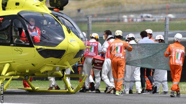 Medical officers tend to Swiss Moto3 rider Jason Dupasquier