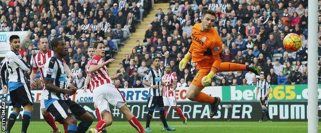 Aleksandar Mitrovic (left) watches as his header comes back off the post