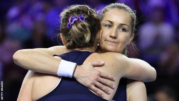 Alicia Barnett and Olivia Nicholls hug after Great Britain's Billie Jean King Cup defeat by Australia