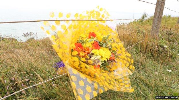 A floral tribute left by Arthur's twin brother, Earl