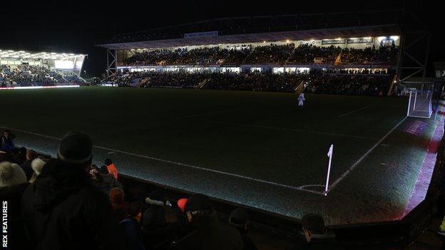 Darkness falls over the Weston Homes Stadium after the floodlights fail