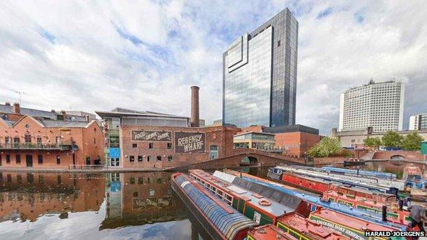 Gas Street Basin in modern day Birmingham, with canal boats moored up and refurbished buildings from the canals industrial past transformed into bars and restaurants, with sky scrapers in the background.