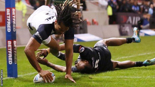 Winger Dominic Young scores a try for England