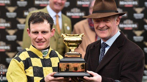 Trainer Willie Mullins and jockey Paul Townend lift the Gold Cup