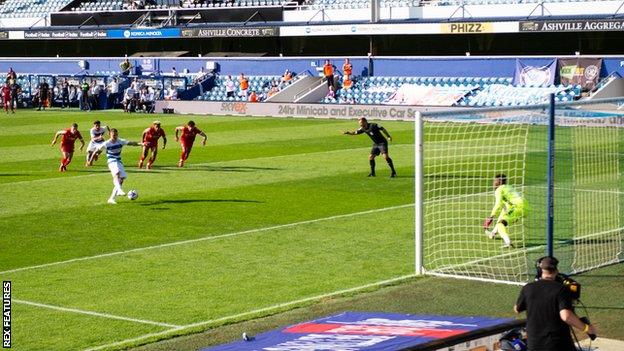 Lyndon Dykes thrashes the ball into the top corner