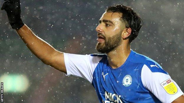 Serhat Tasdemir celebrates scoring for Peterborough