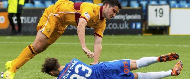 Motherwell's Carl McHugh sufferers a cut eye in a collision with Kilmarnock's Dean Hawkshaw