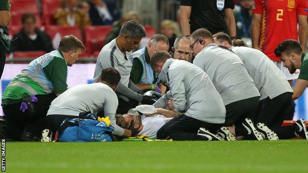 Luke Shaw receives treatment at Wembley