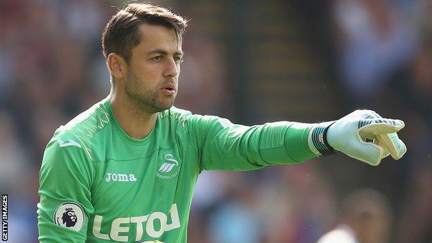 Lukasz Fabianski points something out to his team during a Swansea City match