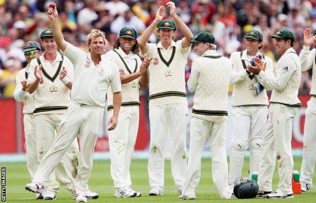 Shane Warne of Australia celebrates his 700th wicket with his team-mates after bowling out Andrew Strauss of England in 2006