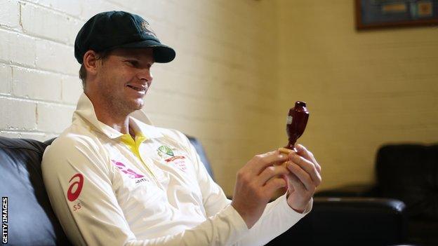 Steve Smith smiles at the Ashes urn