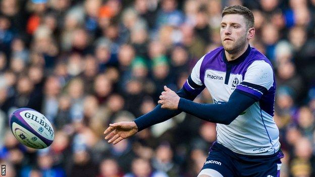 Finn Russell sends out a pass for Scotland against France