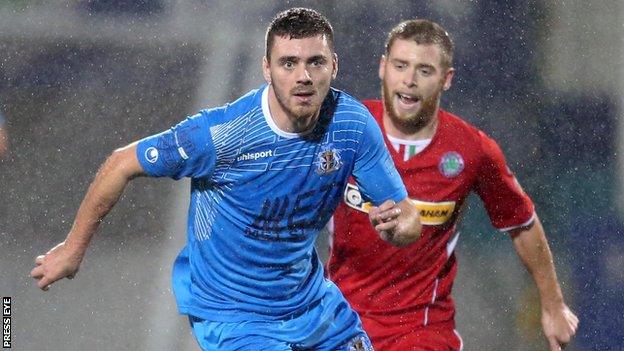 Chris Ramsey battles with Cliftonville's James Knowles last year