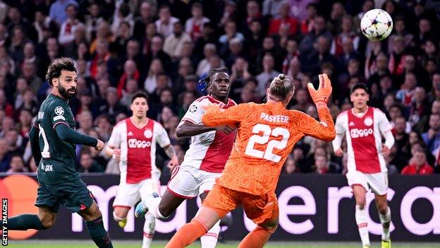 Mohamed Salah clips Liverpool ahead against Ajax in the Champions League