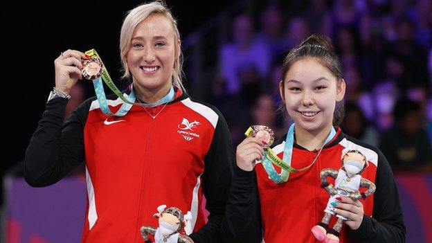 Charlotte Carey and Anna Hursey receive their bronze medals