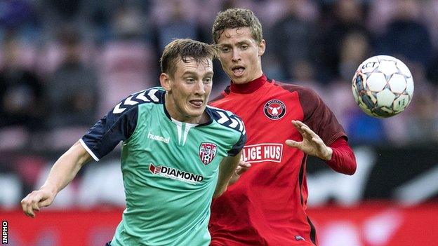 Derry City's Ronan Curtis and Andre Roemer of Midtjylland vie for possession at the MCH Arena