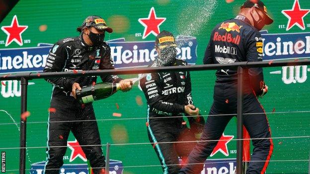 Hamilton, Bottas and Verstappen spray champagne on the podium