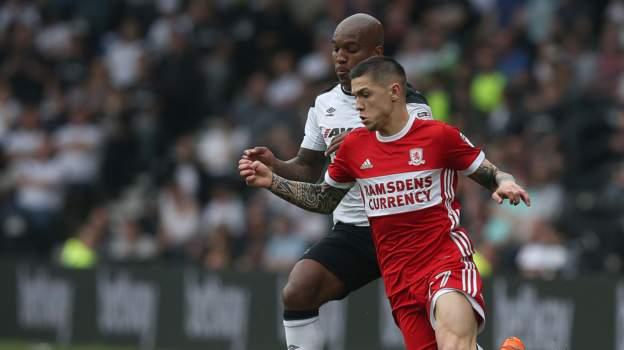 Middlesbrough's Muhamed Besic fights for possession with Andre Wisdom of Derby County