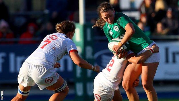 Michelle Claffey of Ireland and USA try-scorer Kimber Rozier in action at Energia Park