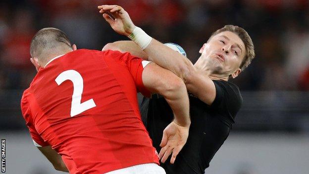 Beauden Barrett is tackled by Ken Owens at the 2019 World Cup