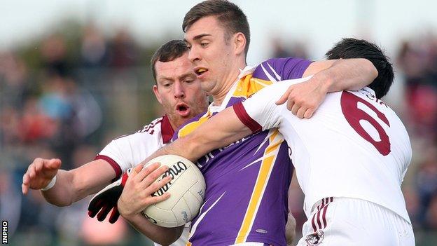 Slaughtneil pair Patsy Bradley and Chrissy McKaigue tackle Derrygonnelly's Connall Jones